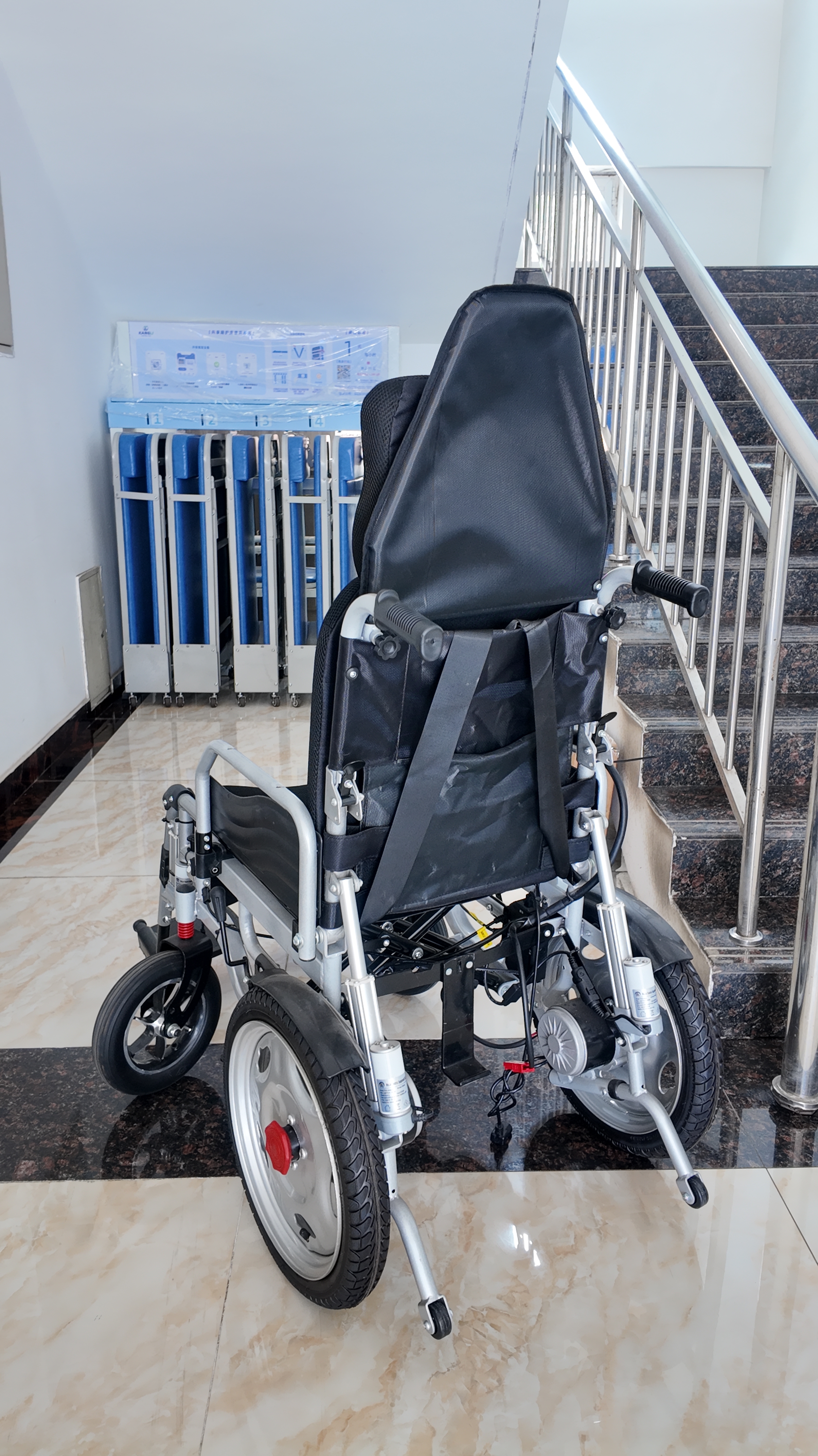 Reclining-backward electric wheelchair with high backrest